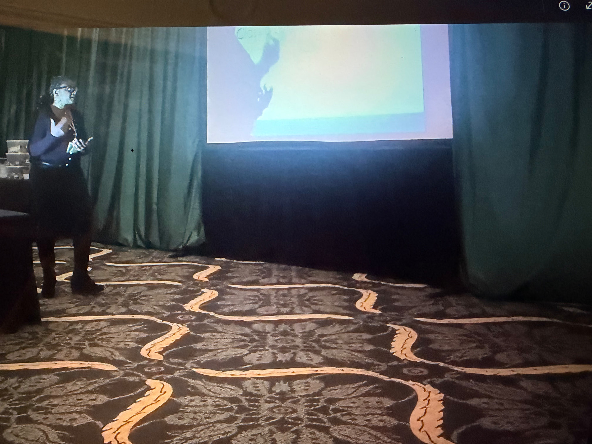 Dr. Allana Coffee speaking at an event